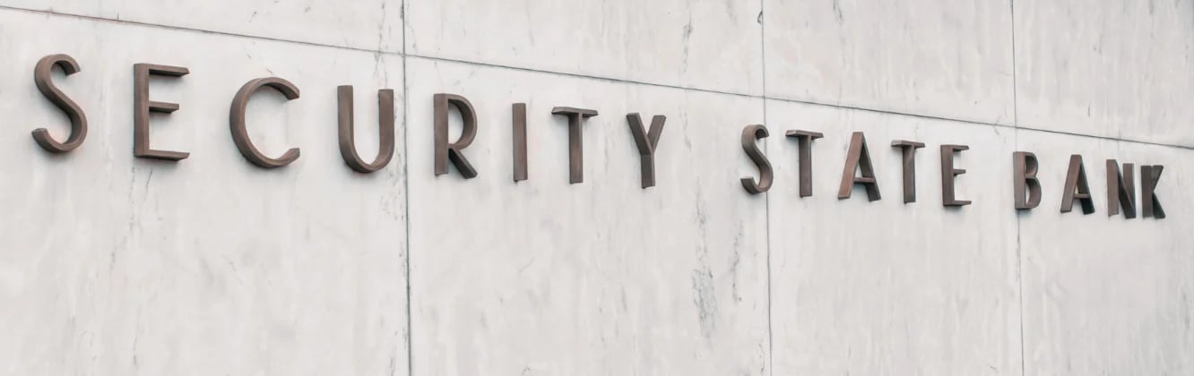Security State Bank signage on white stone wall